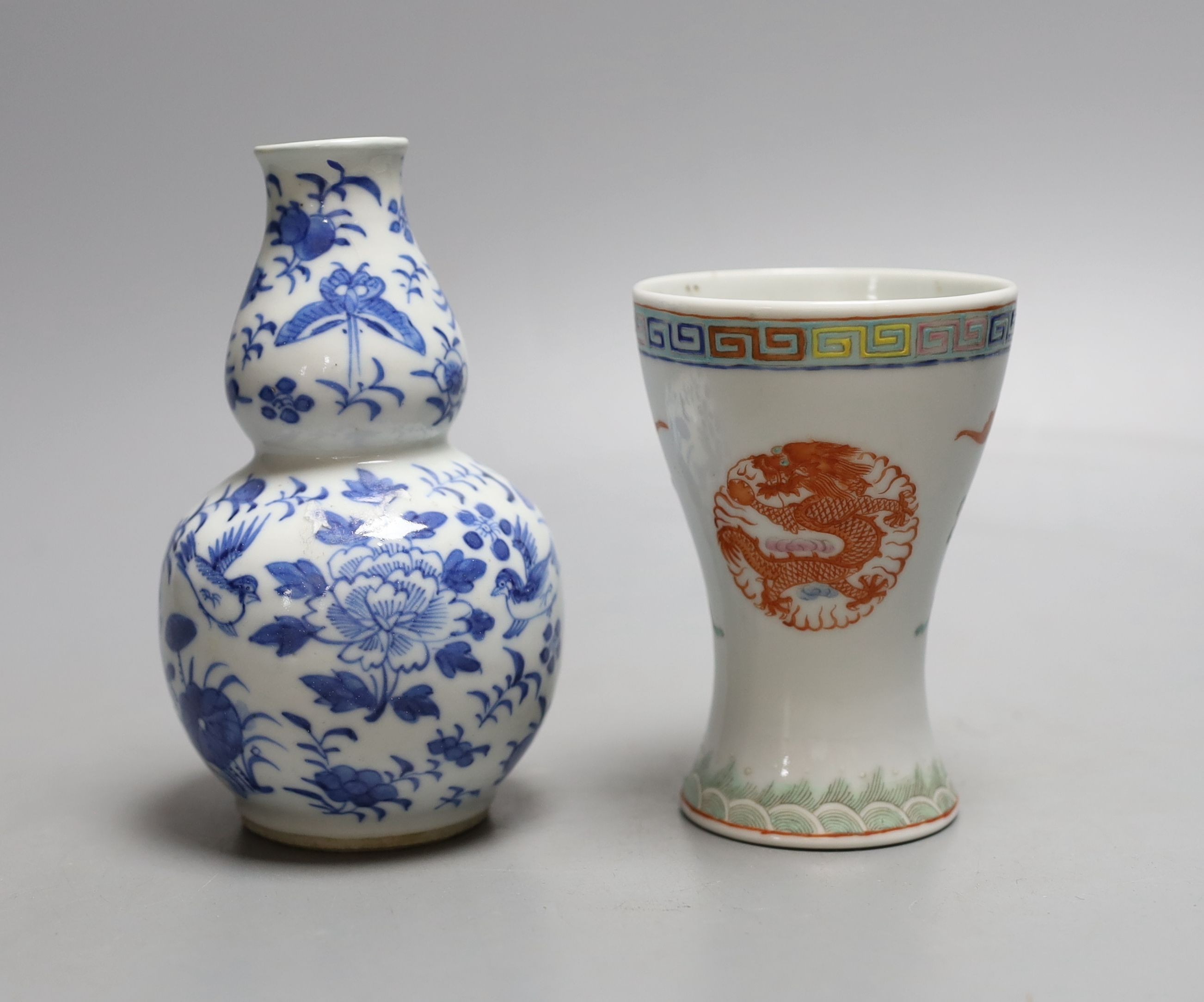 A 19th century Chinese blue and white gourd shape vase and a Chinese cup with inscription on base - tallest 14cm